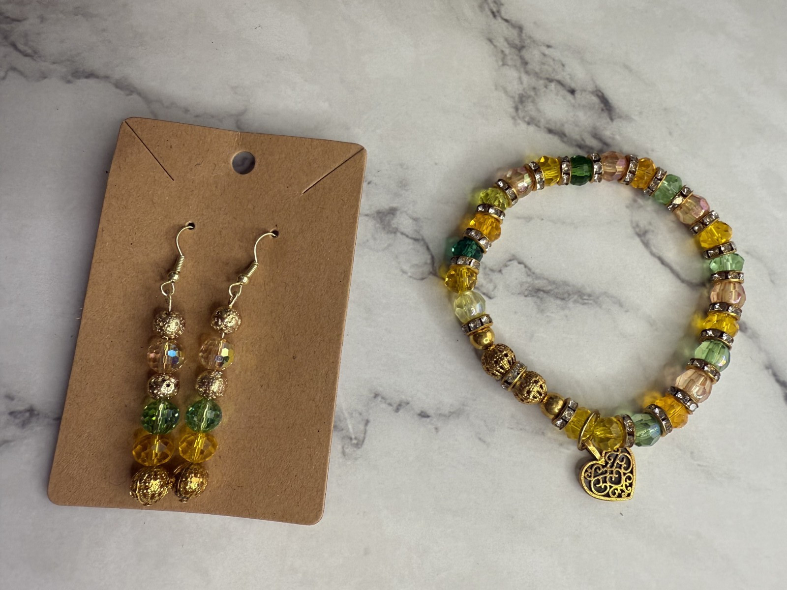 handmade beaded dangle earrings and bracelet green, yellow and gold tones heart