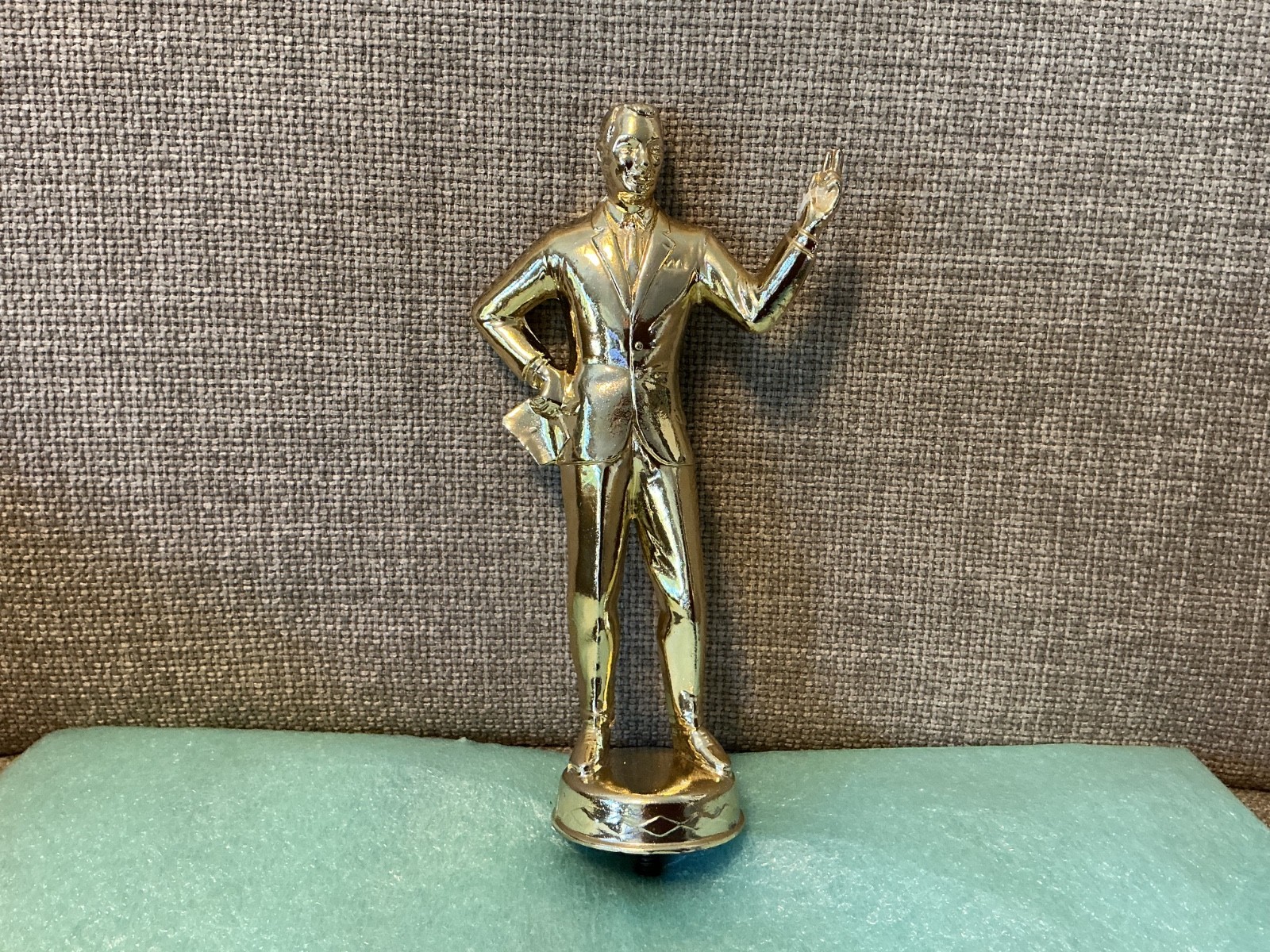 vintage salesman trophy topper, 7" tall, solid metal
