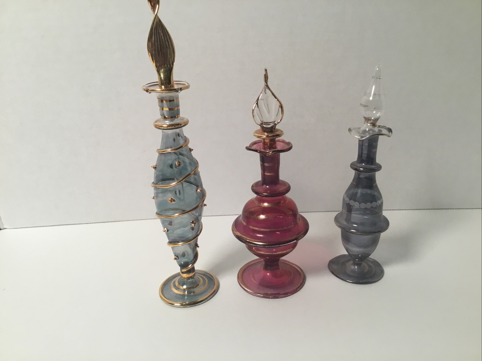 3 Egyptian Hand Blown Glass Perfume Bottles .