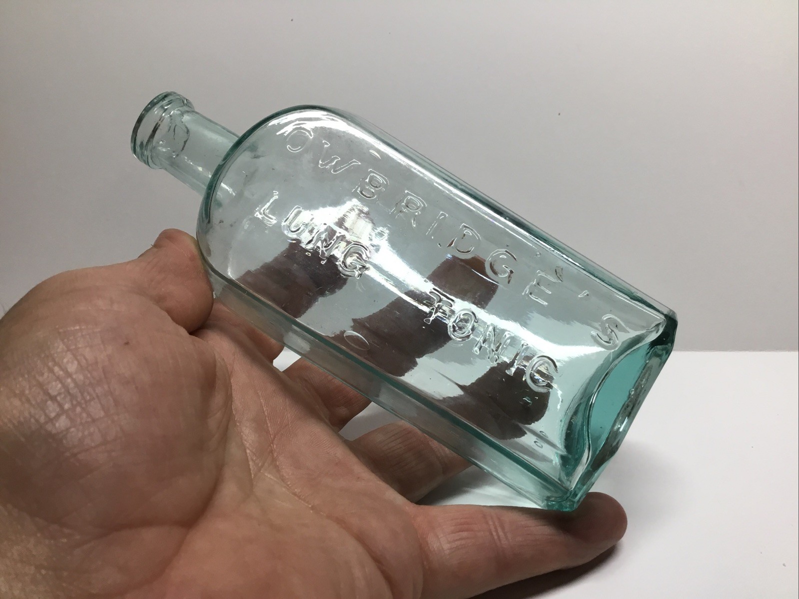 Large Antique Aqua Owbridge’s Lung Tonic Medicine Bottle.