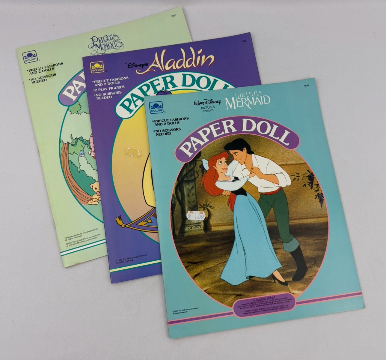 NEW Golden Book Paper Doll - Disney’s Little Mermaid, Aladdin & Precious Moment