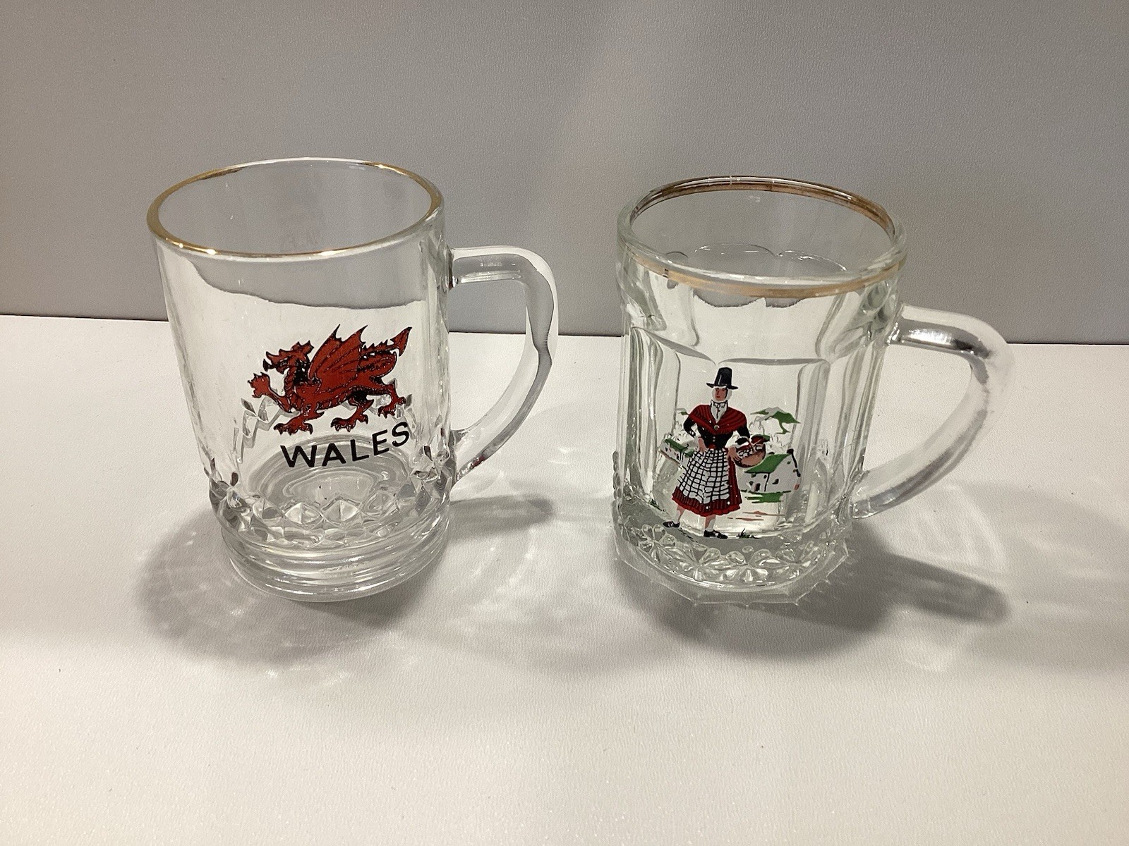 Two Miniature Souvenir Beer Glasses Depicting Wales Gold Rims
