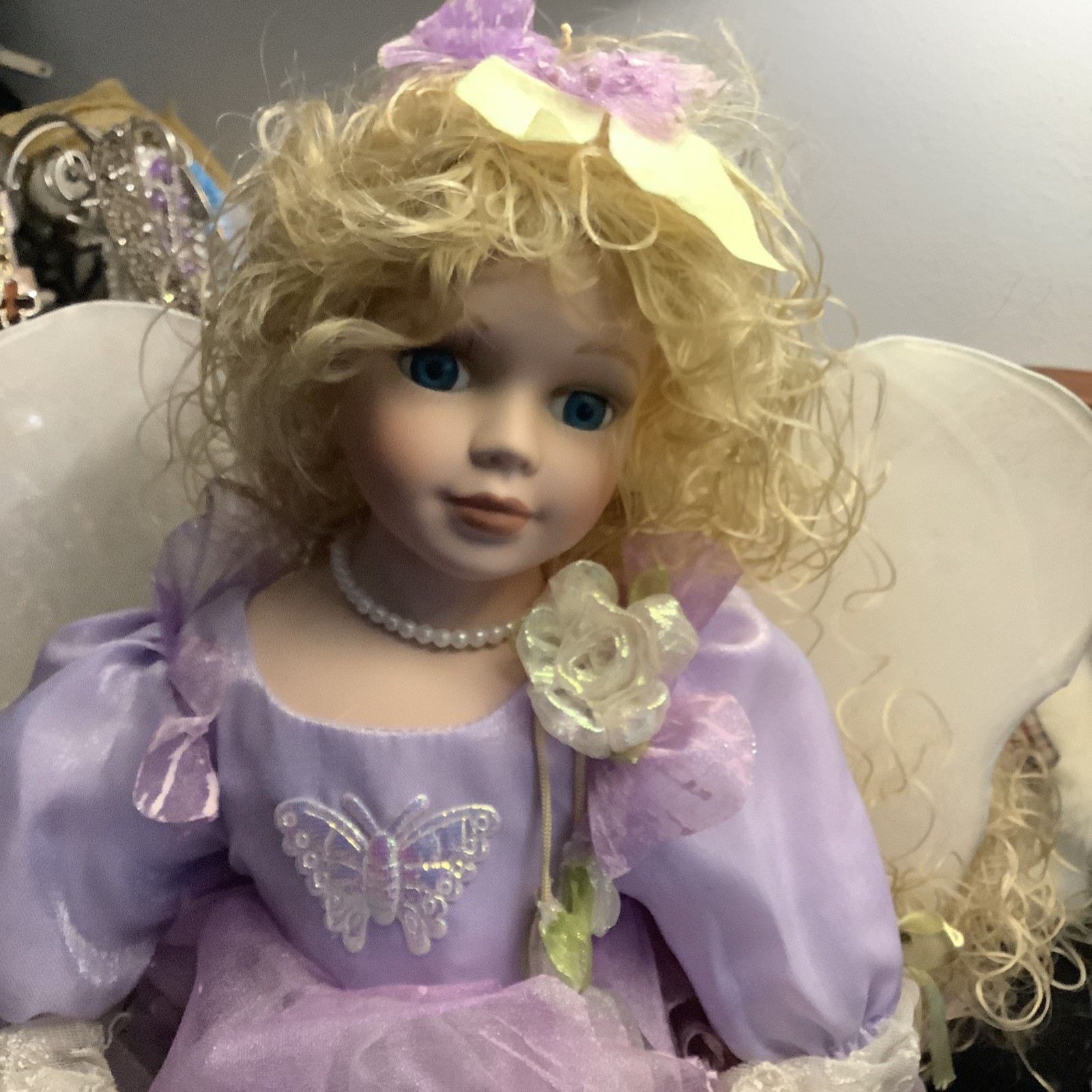 Fantasy Fairy Doll with Blonde Curly Hair, Purple Dress, and Wings