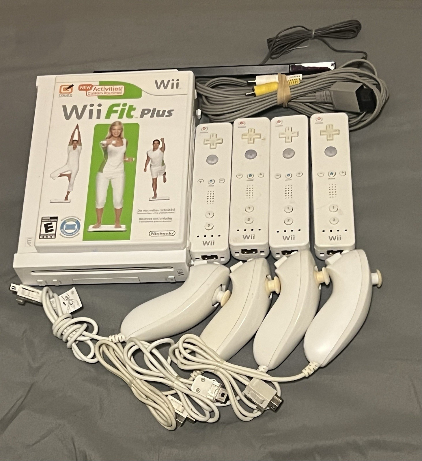 Nintendo Wii RVL-001 White Console Bundle w/ Wii Fit Plus, 4 Remotes, 4 Nunchuks