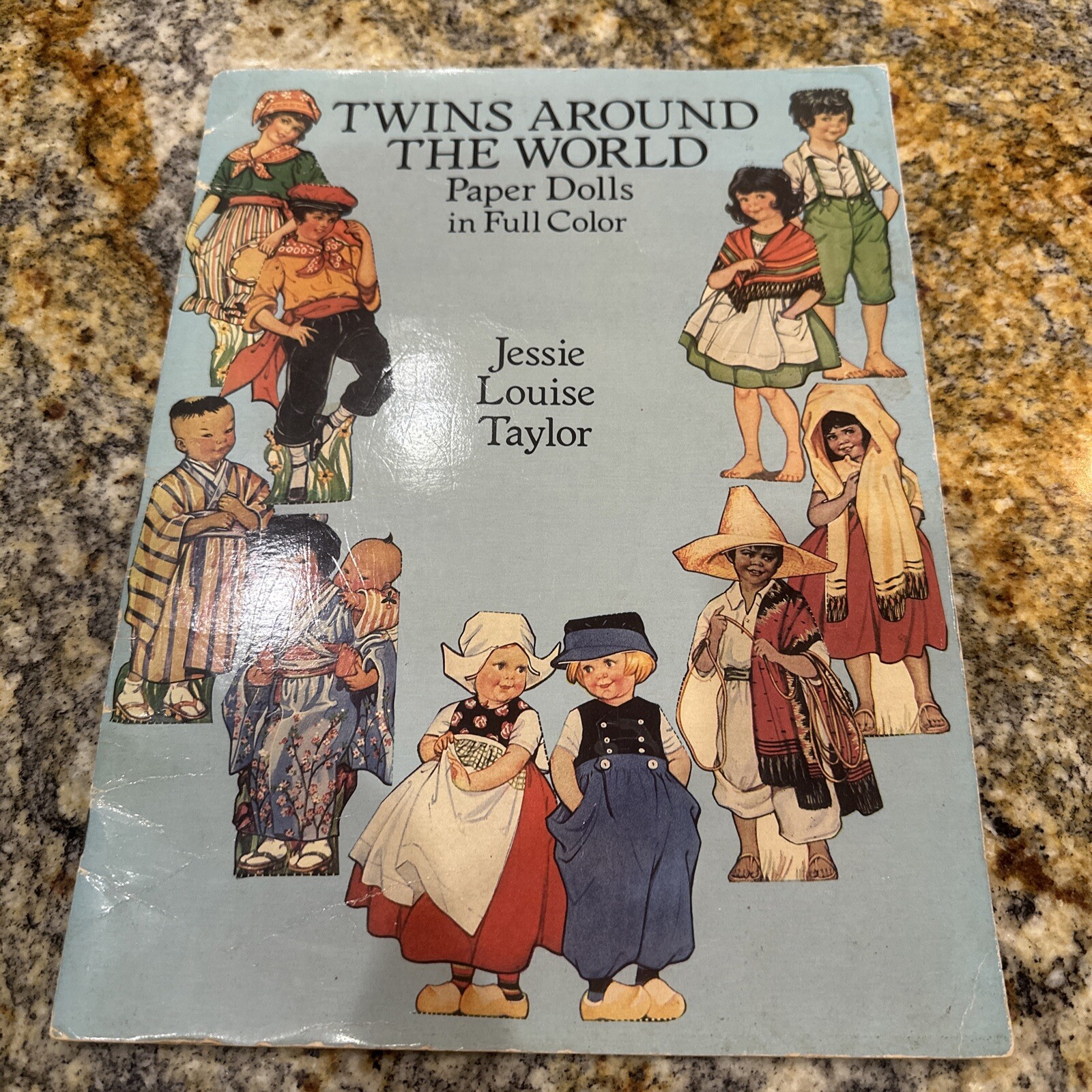 Twins Around the World paper dolls in Full Color by Jessie Louise Taylor 1989