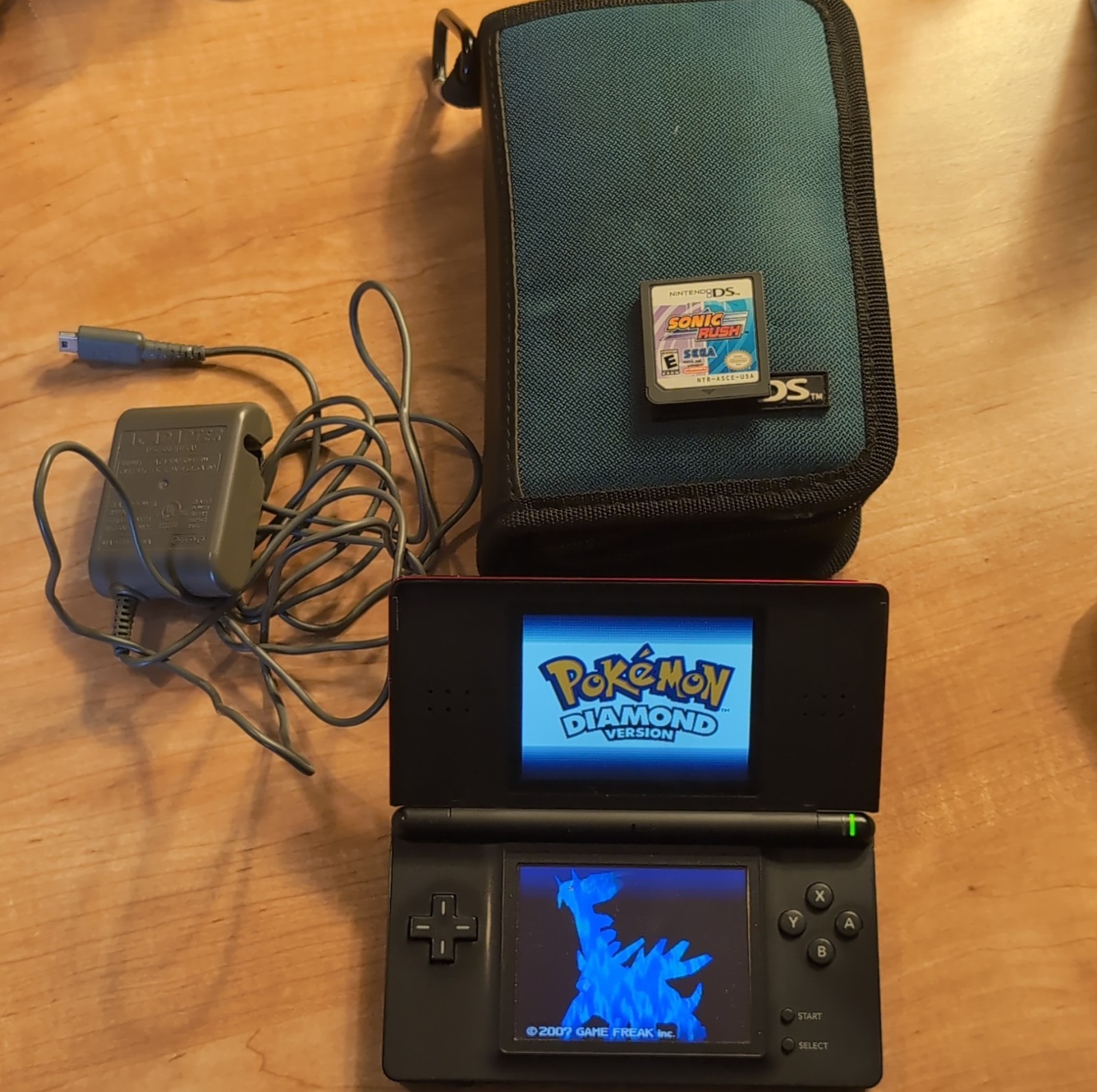 Nintendo DS Lite with Pokémon Diamond, Sonic Rush, Charger, Case, Booklet
