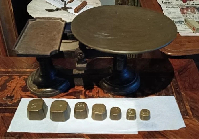 antique cast iron scale with weights from the late 19th century