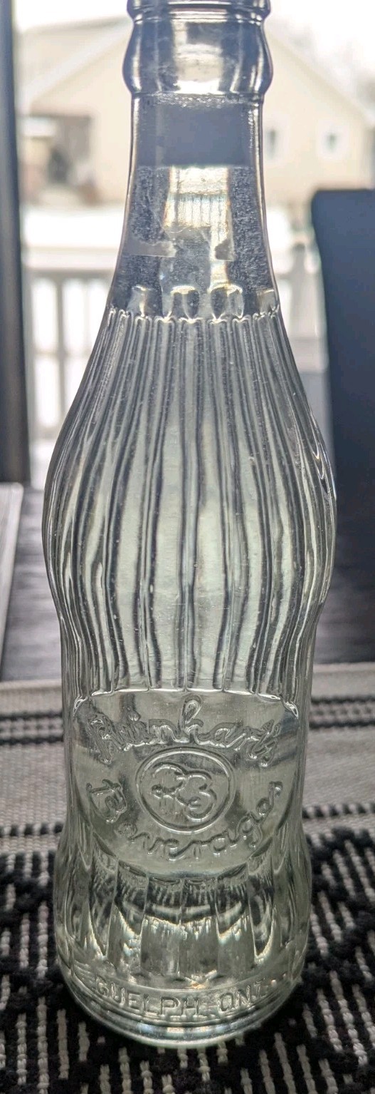 VINTAGE REINHART BEVERAGES GUELPH ONT. 12 OZ CLEAR SODA BOTTLE
