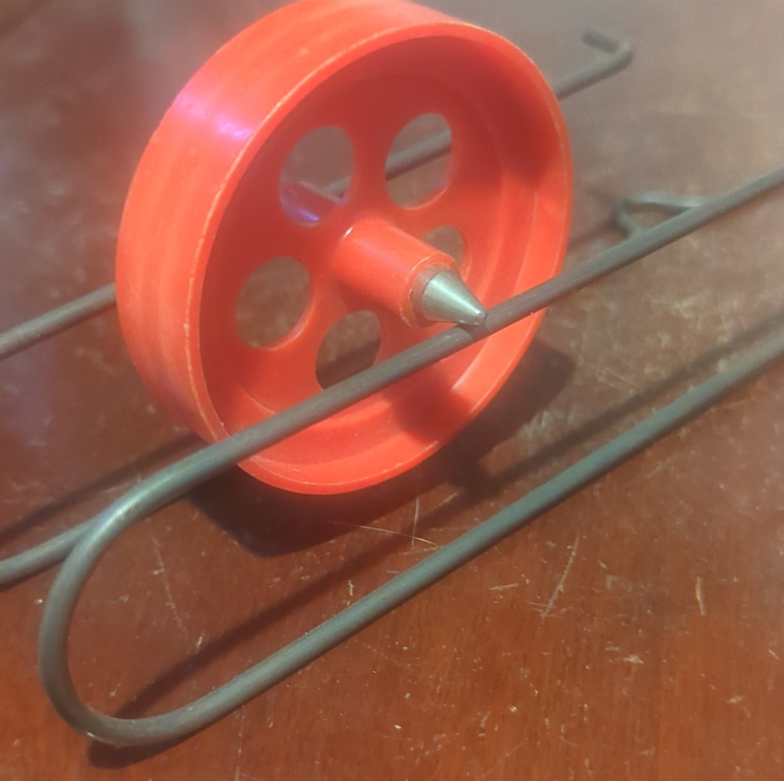 Vintage Red Spinning Top with Metal Frame