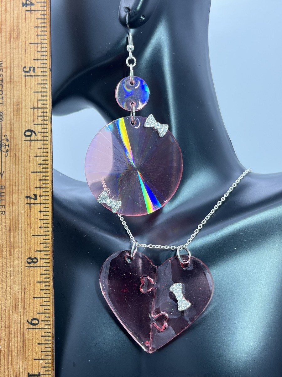 Earring & necklace w/ transparent red hearts & bowties on silver ptd chain cos