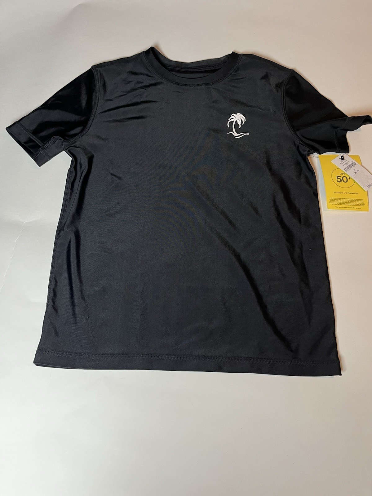 NWT boys Gap size 6-7 (boys size small) black swim guard top.