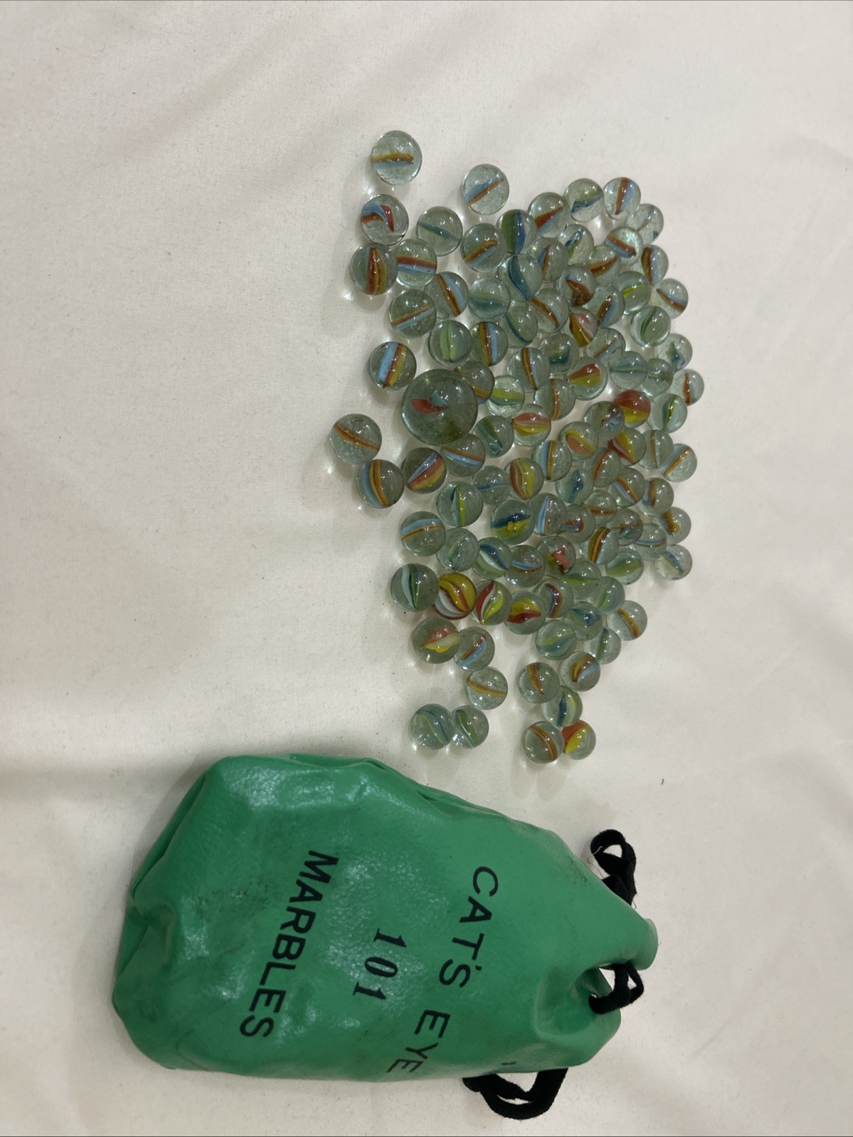 101 CAT’S EYE Marbles In Green Vinyl Drawstring Bag