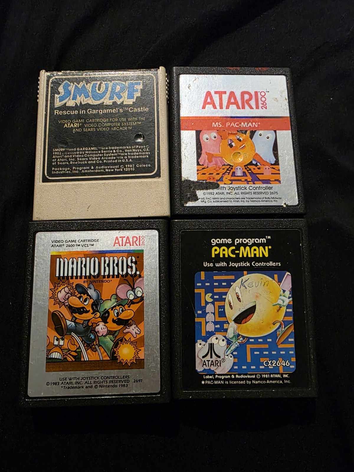Lot for Atari 2600: Smurf, Ms. Pac-Man, Mario Bros, Pac-Man. Untested. 