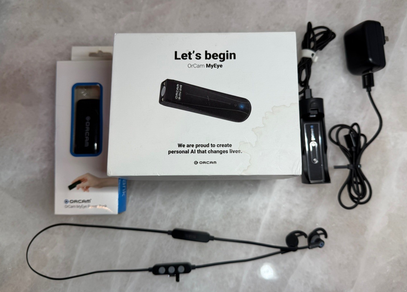 OrCam MyEye 2, Rev B.  + OrCam Chargers + OrCam Bluetooth earbuds and Power Bank