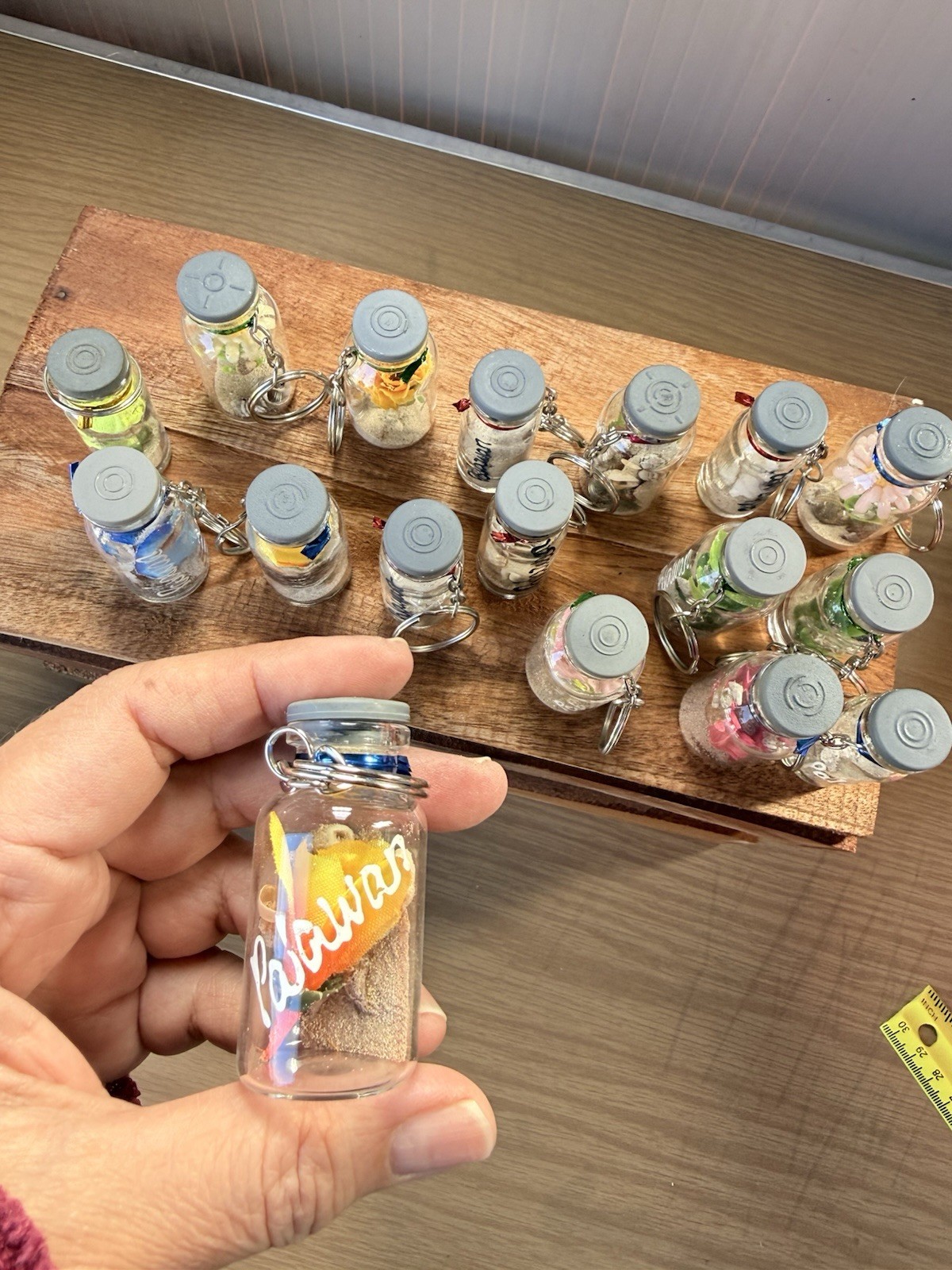 small glass bottle keychain/souvenir decorative floral elements and Sands Inside