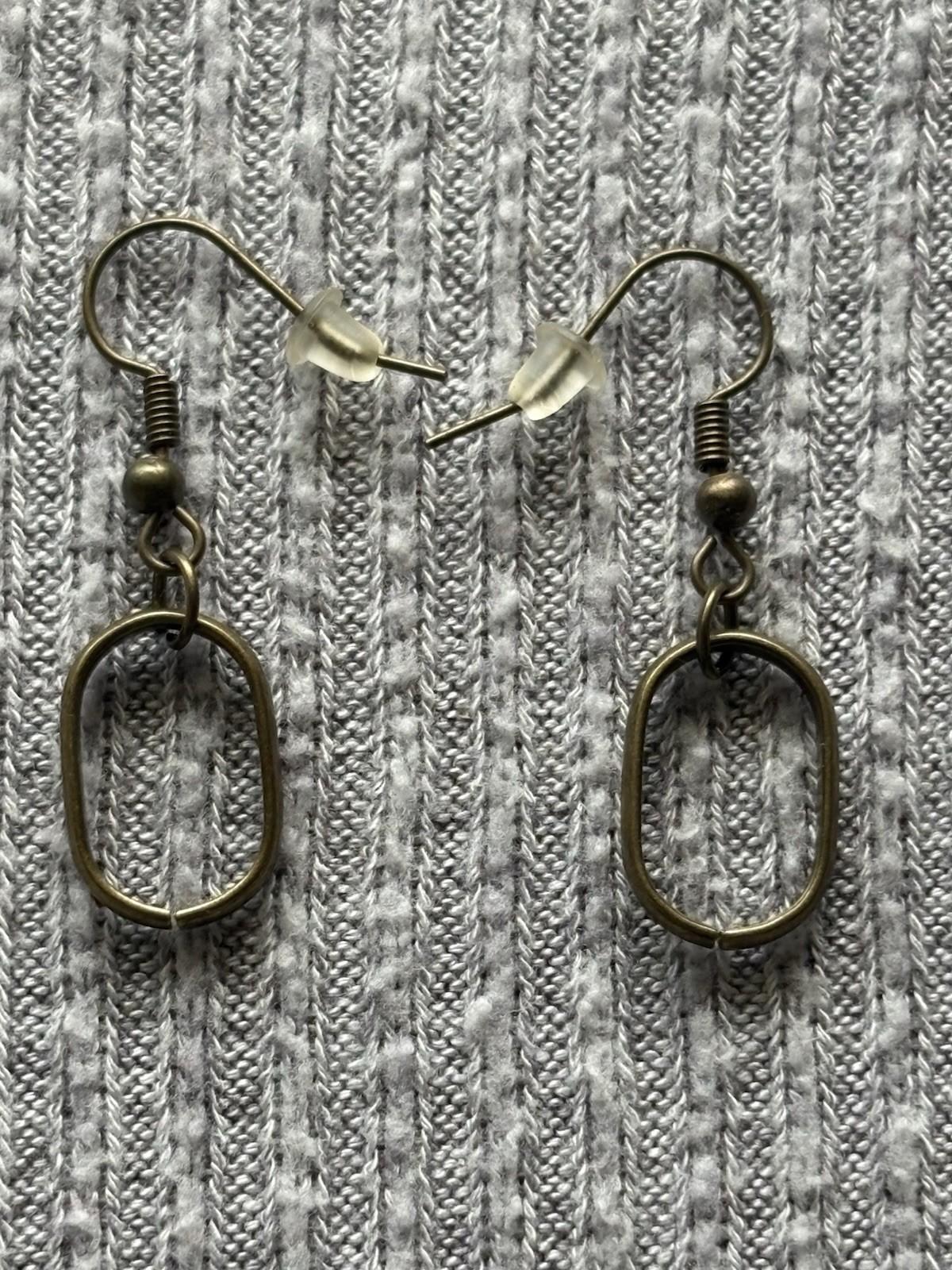 Vintage brass tone geometric theme oval shaped dangle earrings