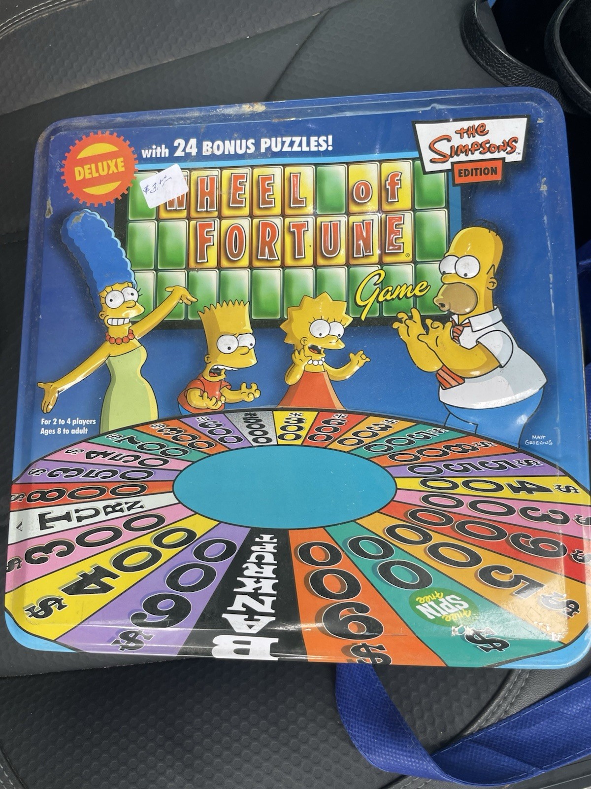 The Simpsons Wheel of Fortune Deluxe Board Game in Collector's Tin