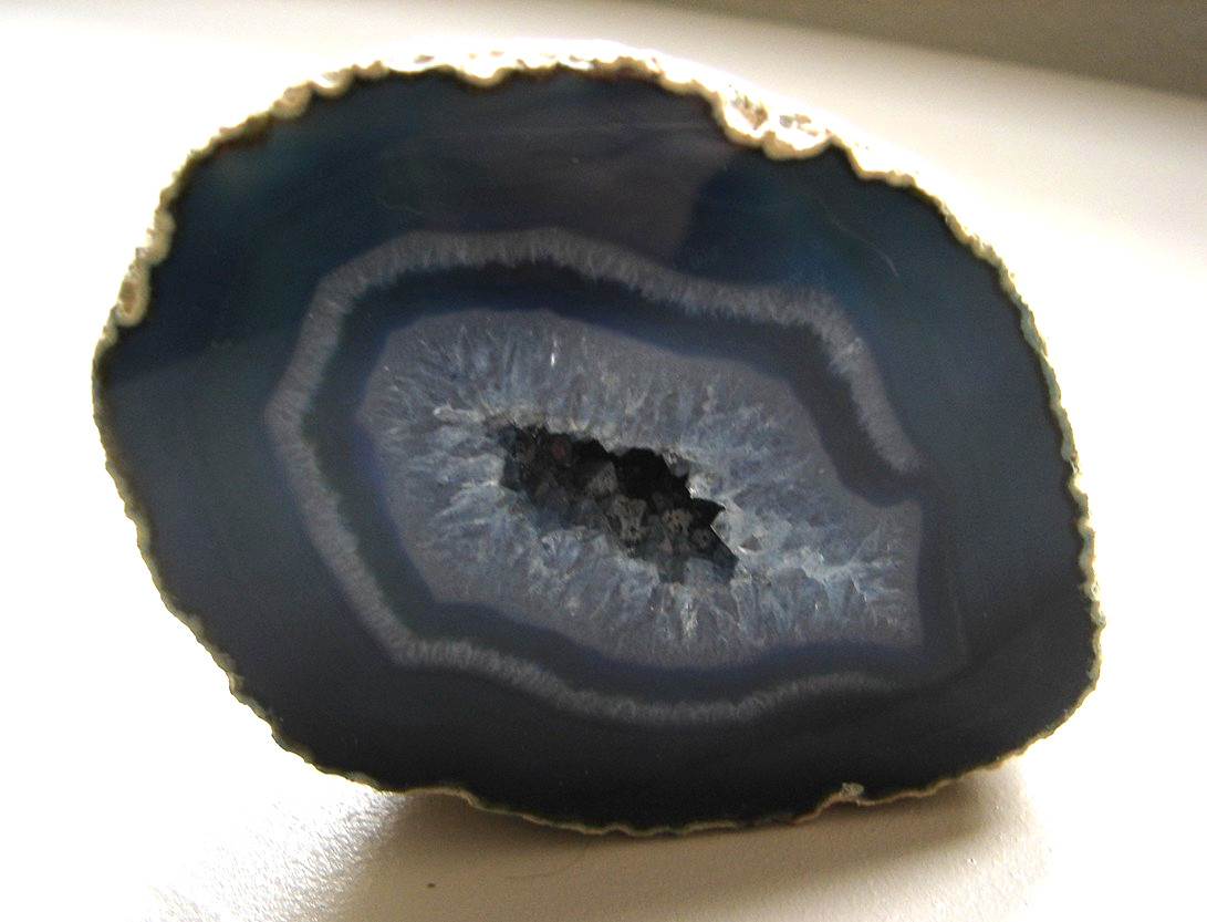 Brazilian blue banded agate geode paperweight