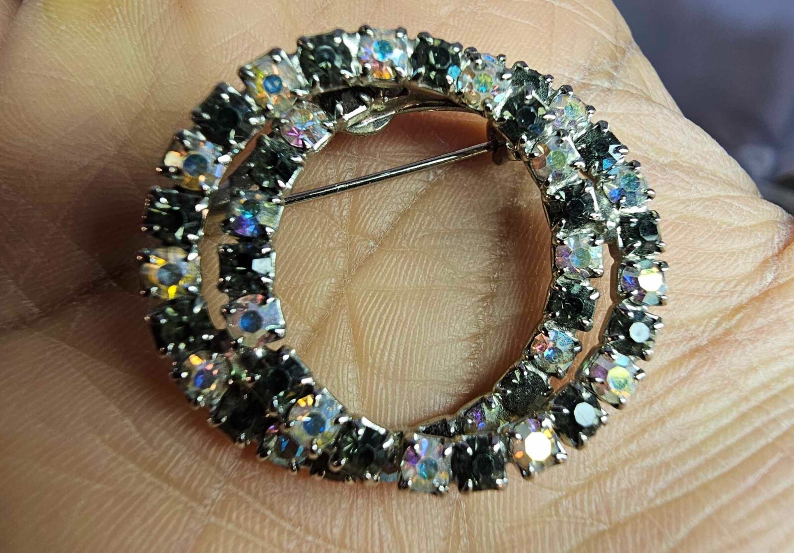 Vtg Silvertone Brooch Pin round interlocking black rhinestone irridescent stone