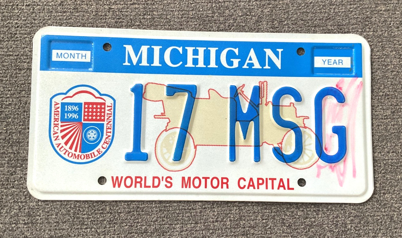 RARE 1990's WORLD MOTOR CAPITAL MICHIGAN GOVERNMENT MSG LICENSE PLATE RARE RARE