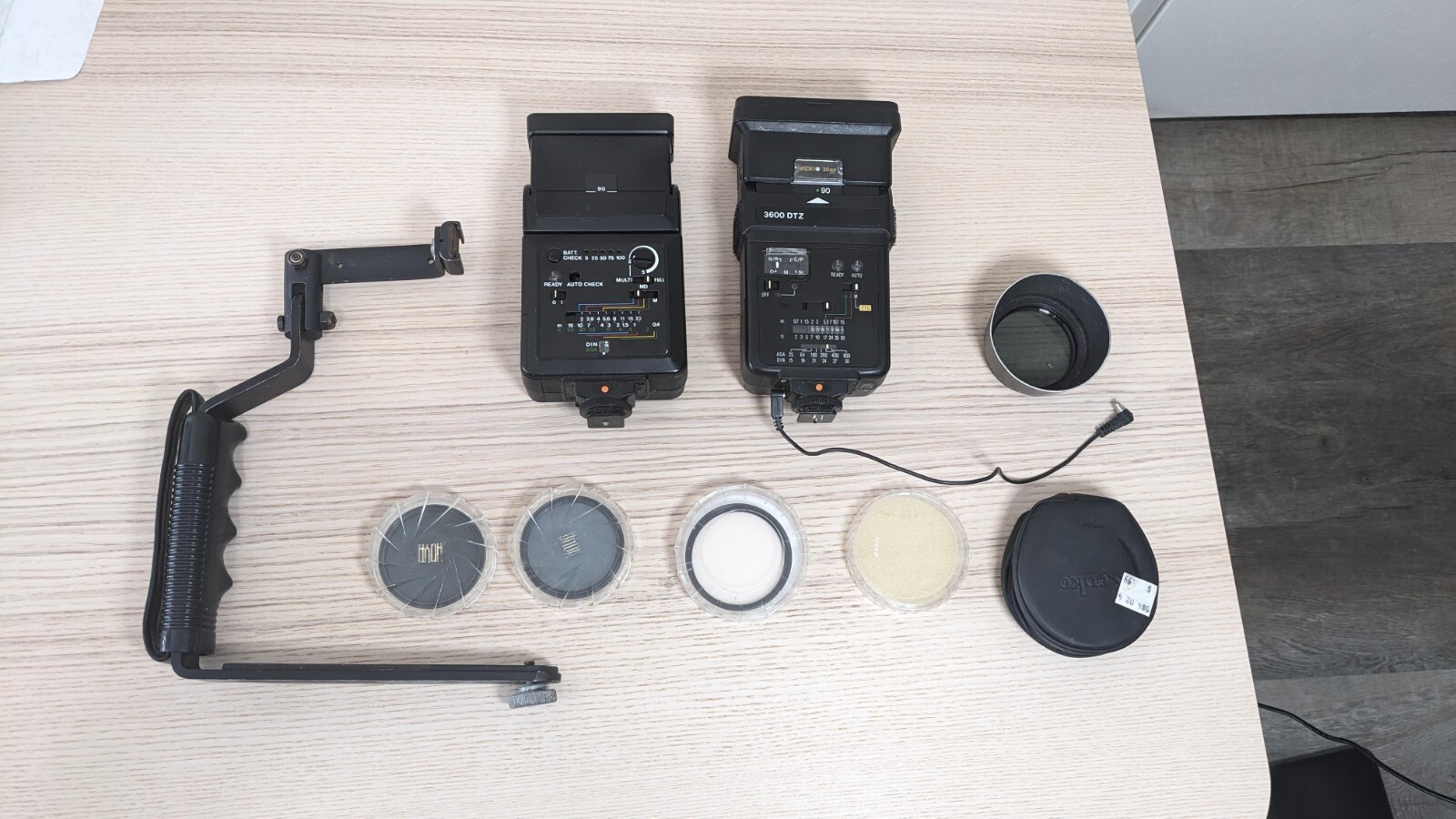 Large Lot Of Camera Accessories - Flash, UV Filters, and C-grip