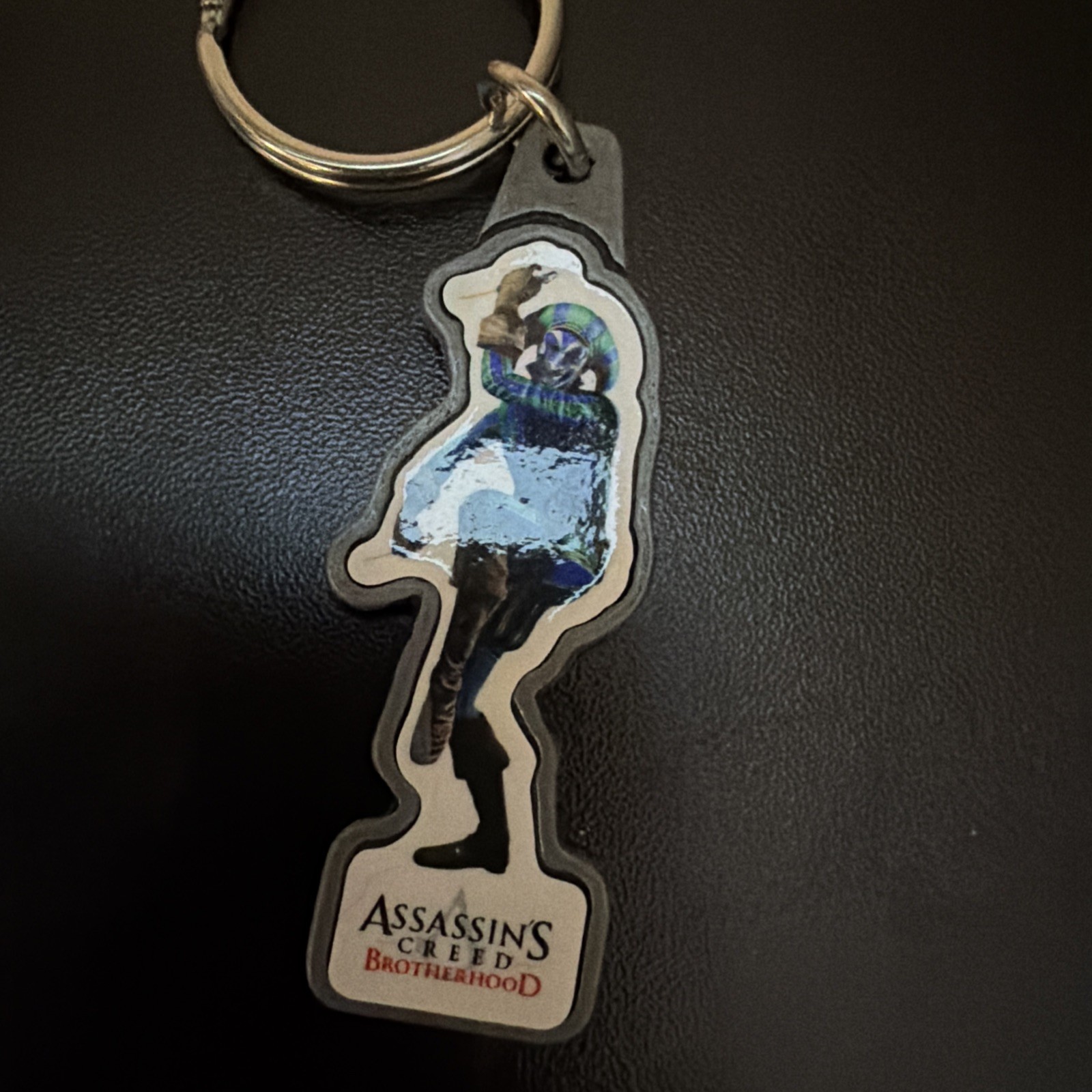 ASSASSIN'S CREED BROTHERHOOD (JESTER PROMO KEYCHAIN)