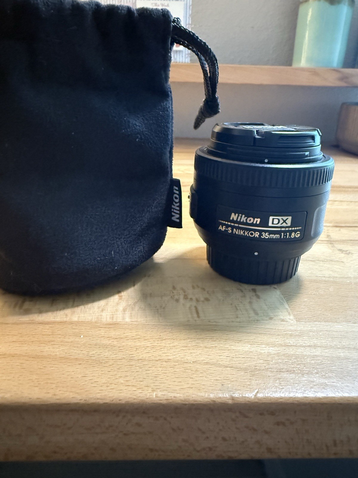 Nikon AF-S DX NIKKOR 35mm f/1.8G prime lens for Nikon F-mount DSLR cameras.