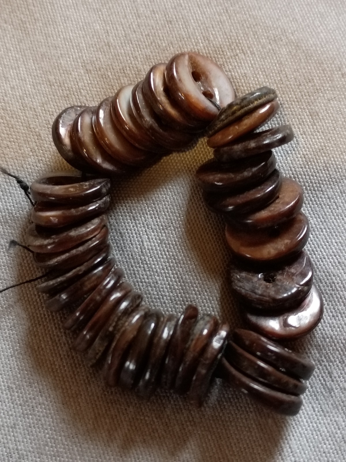 String Of Dyed Antique Mother of Pearl Buttons.