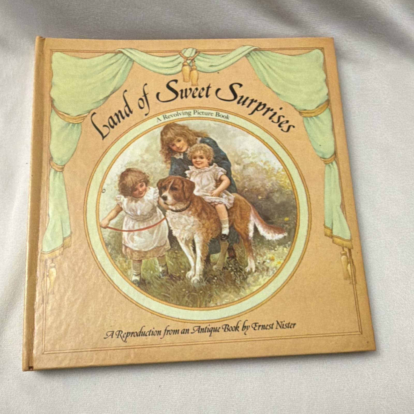 Land of Sweet Surprises by Ernest Nister Illustrated Revolving Picture HC 1983