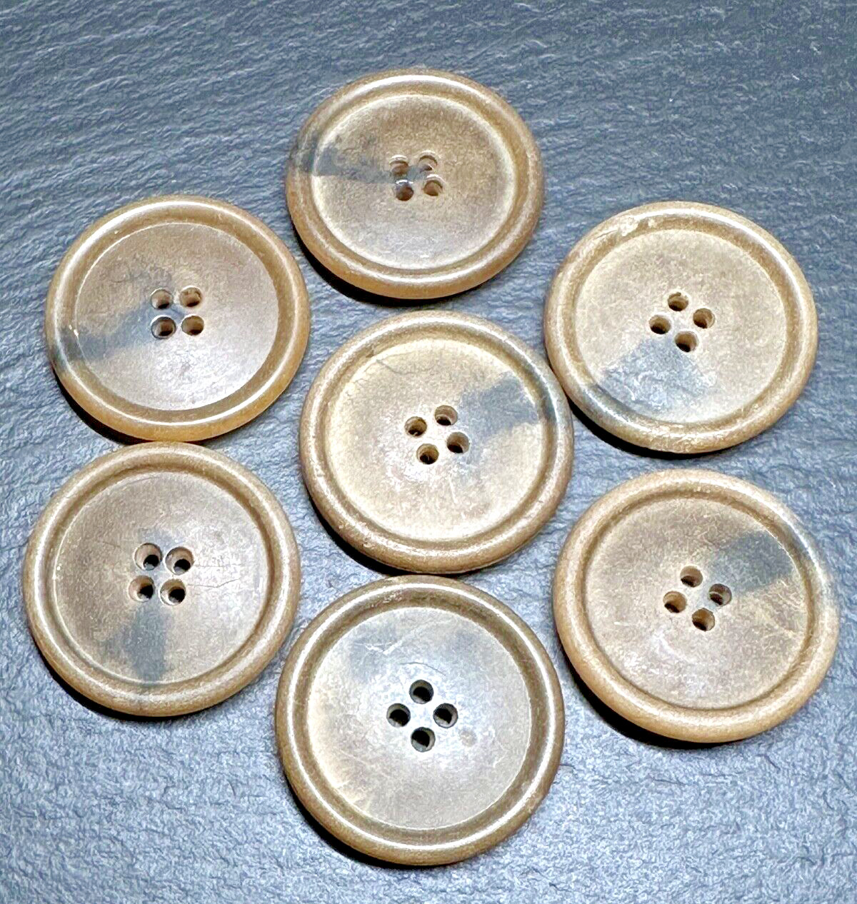 SEVEN VINTAGE 1 3/8" ROUND FOUR HOLE BUTTONS - VEGETABLE IVORY OR RESIN? G402