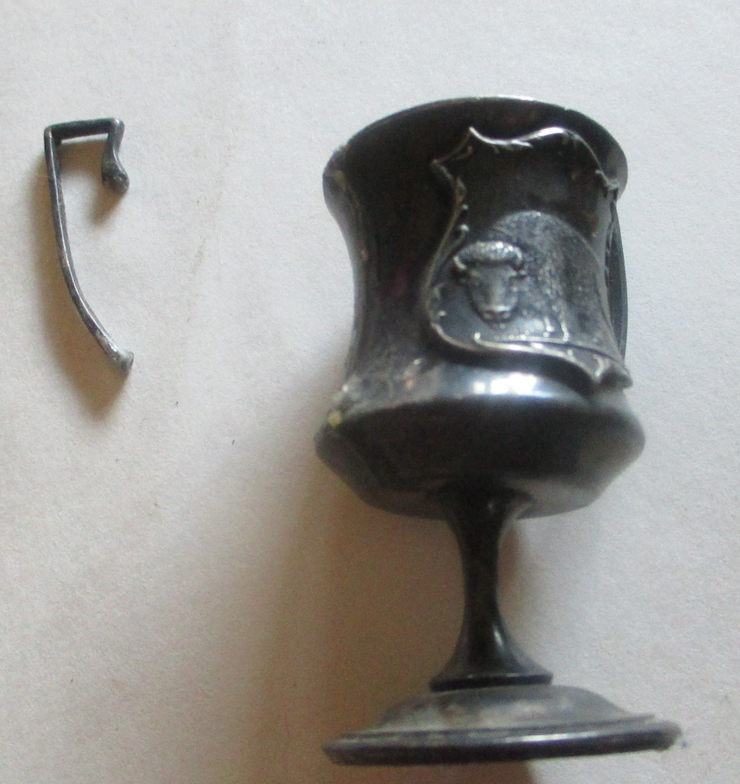 VINTAGE 3" COPPER CUP ON A PEDISTAL WITH TWO HANDLES, AND BUFFALO ON FRONT