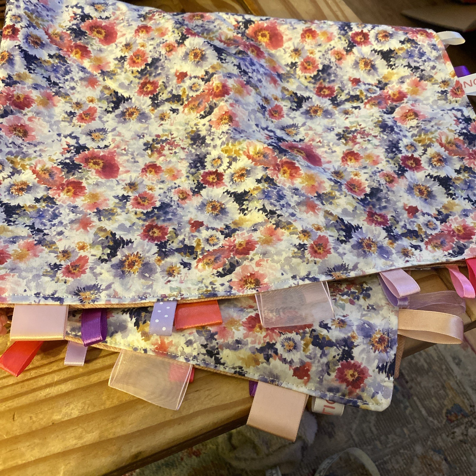 Handmade blanket Taggie pinks, purple and white florals with pink back