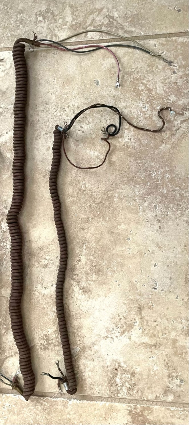 TWO WESTERN ELECTRIC BROWN CLOTH COILED HANDSET CORDS