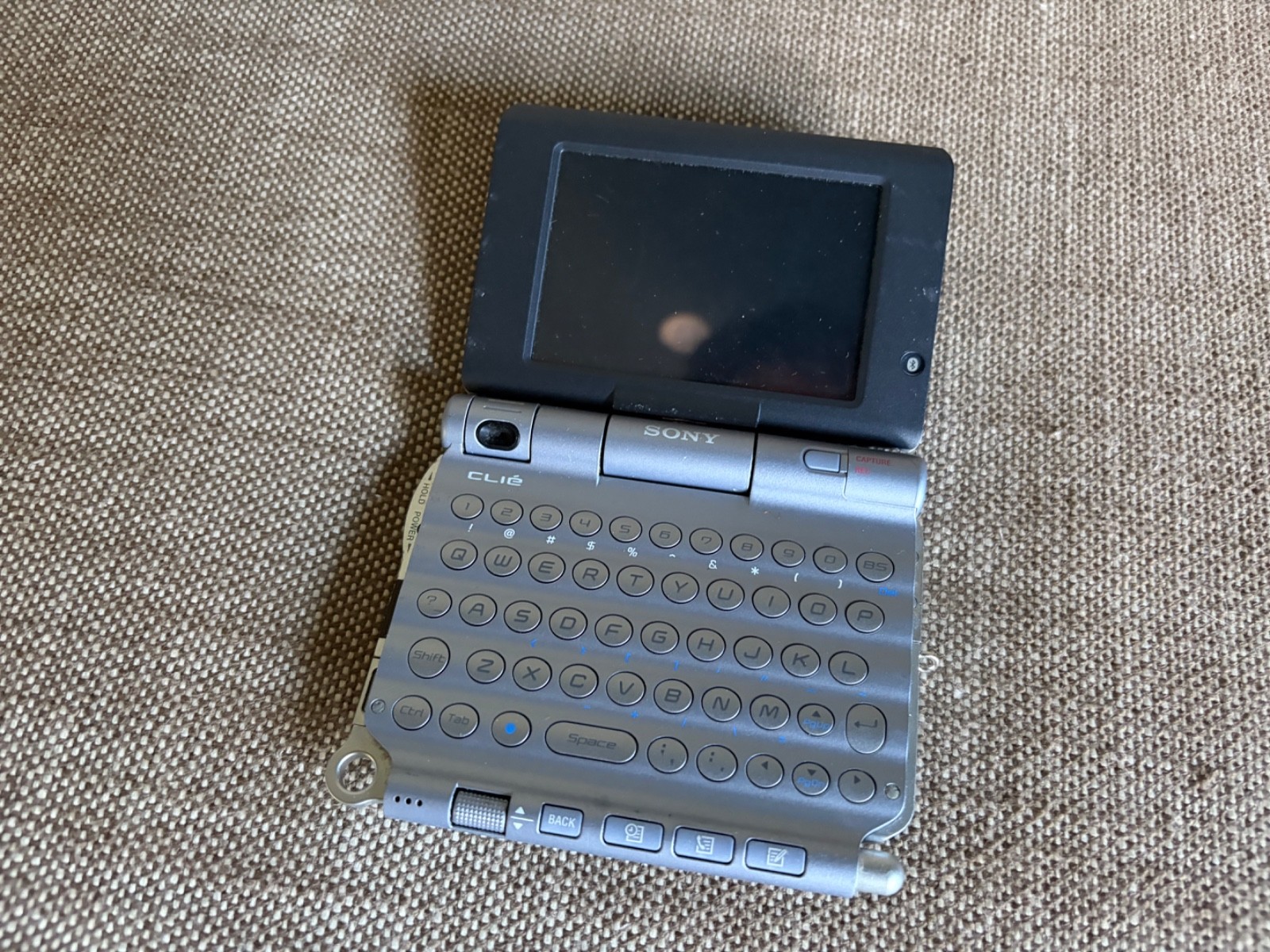 Vintage Sony CLIE PEG-UX40/U Handheld PDA - powers on