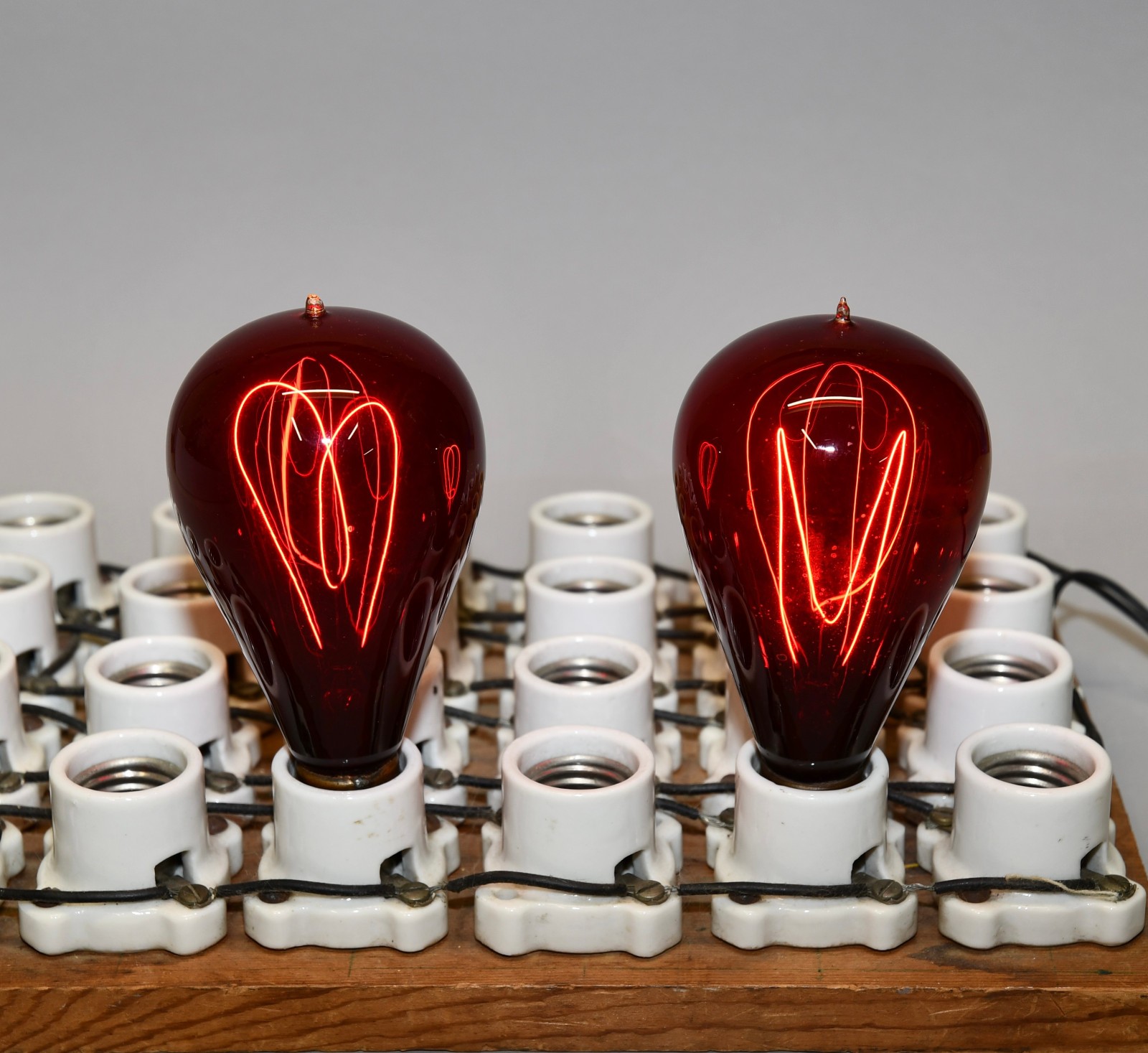 LOT OF 2 ANTIQUE RED GLASS CARBON TIP MEDIUM BASE E26 WORKING LIGHT BULBS!