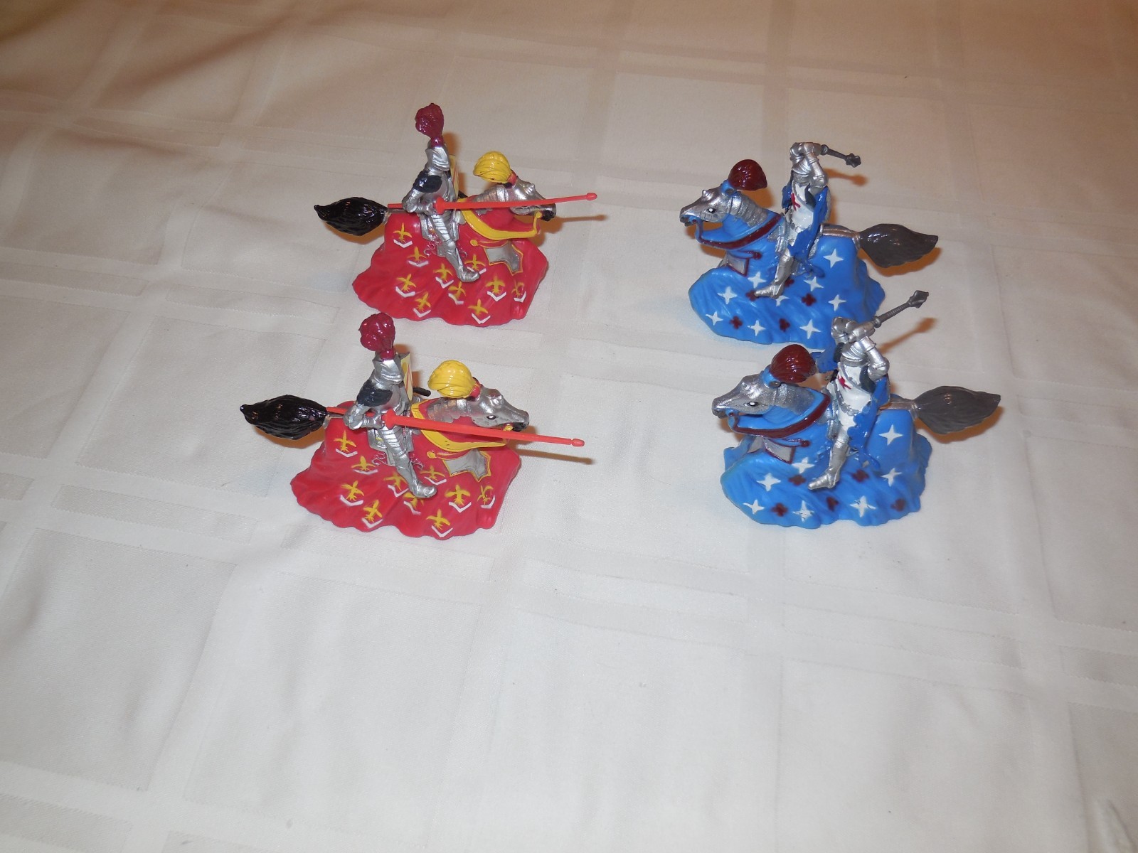 Lot of 4 Britains 1988 plastic Knights on horses. Wheels underneath