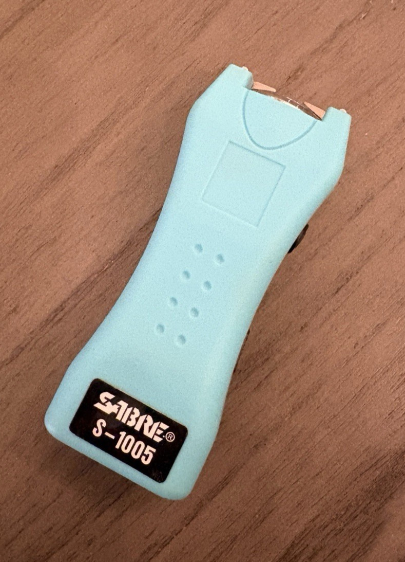Sabre S-1005; 2-In-1 Stun Gun And Flashlight With Aqua Blue