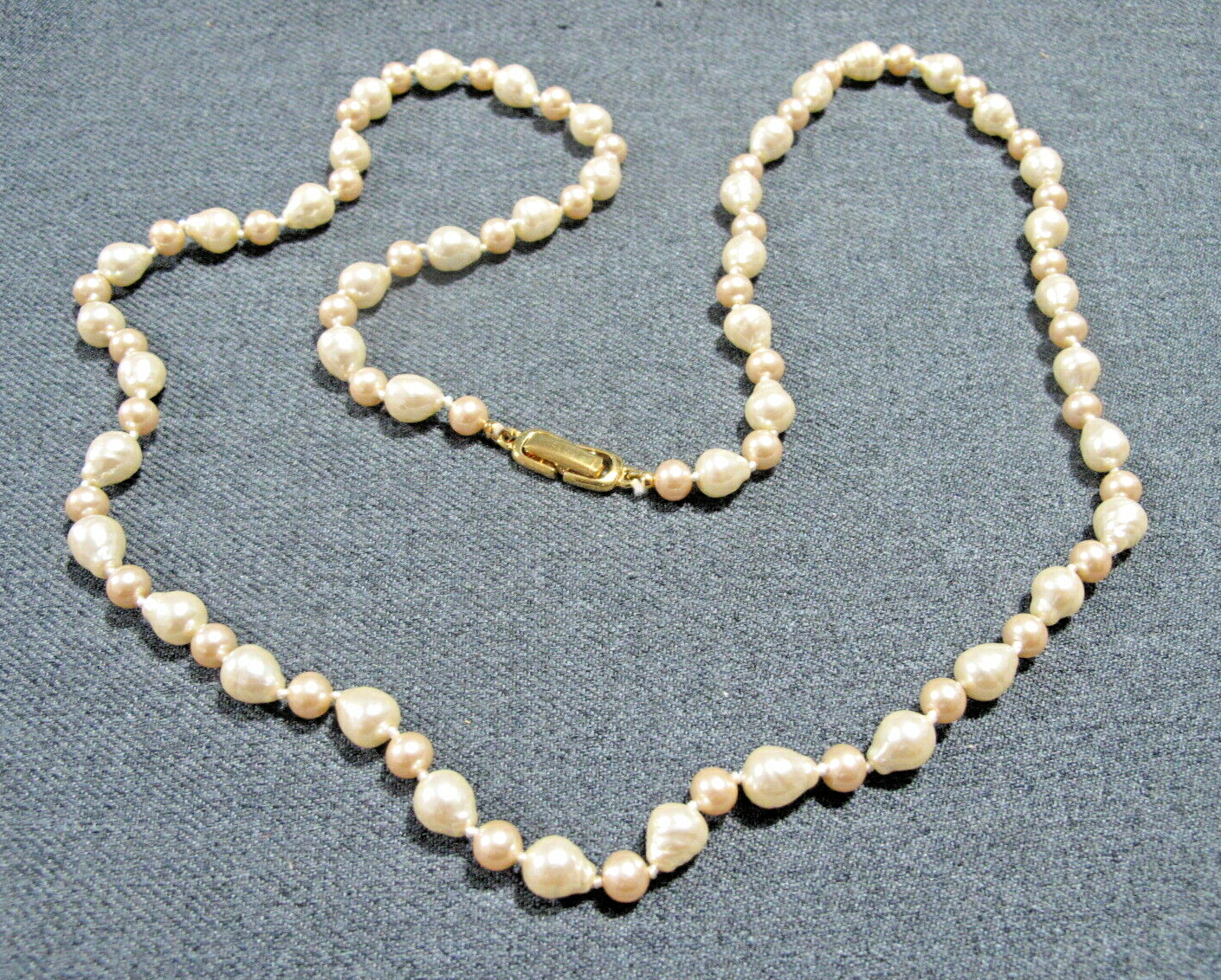 Vintage goldtone metal clasp hand knotted baroque pearls long necklace