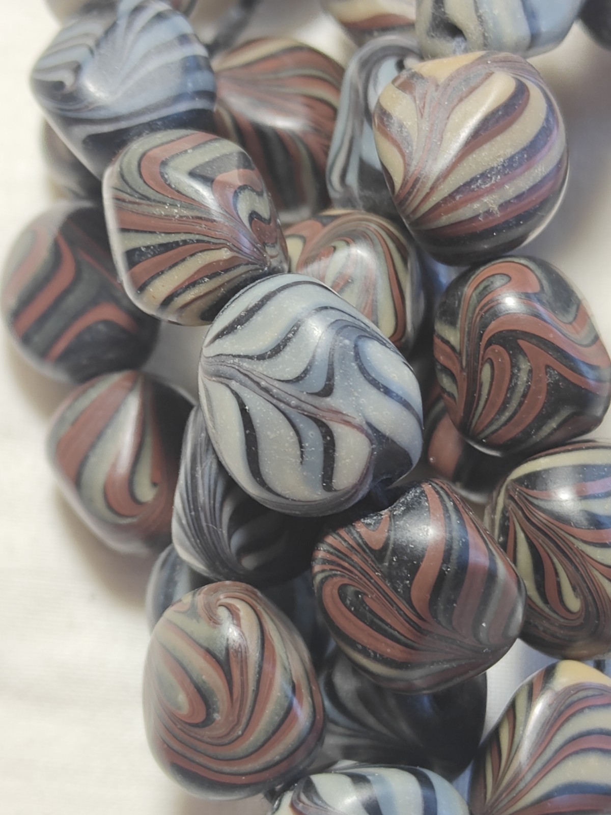 Unusual antique lamp work glass trade bead strand. 128 grams, 18 inches long.