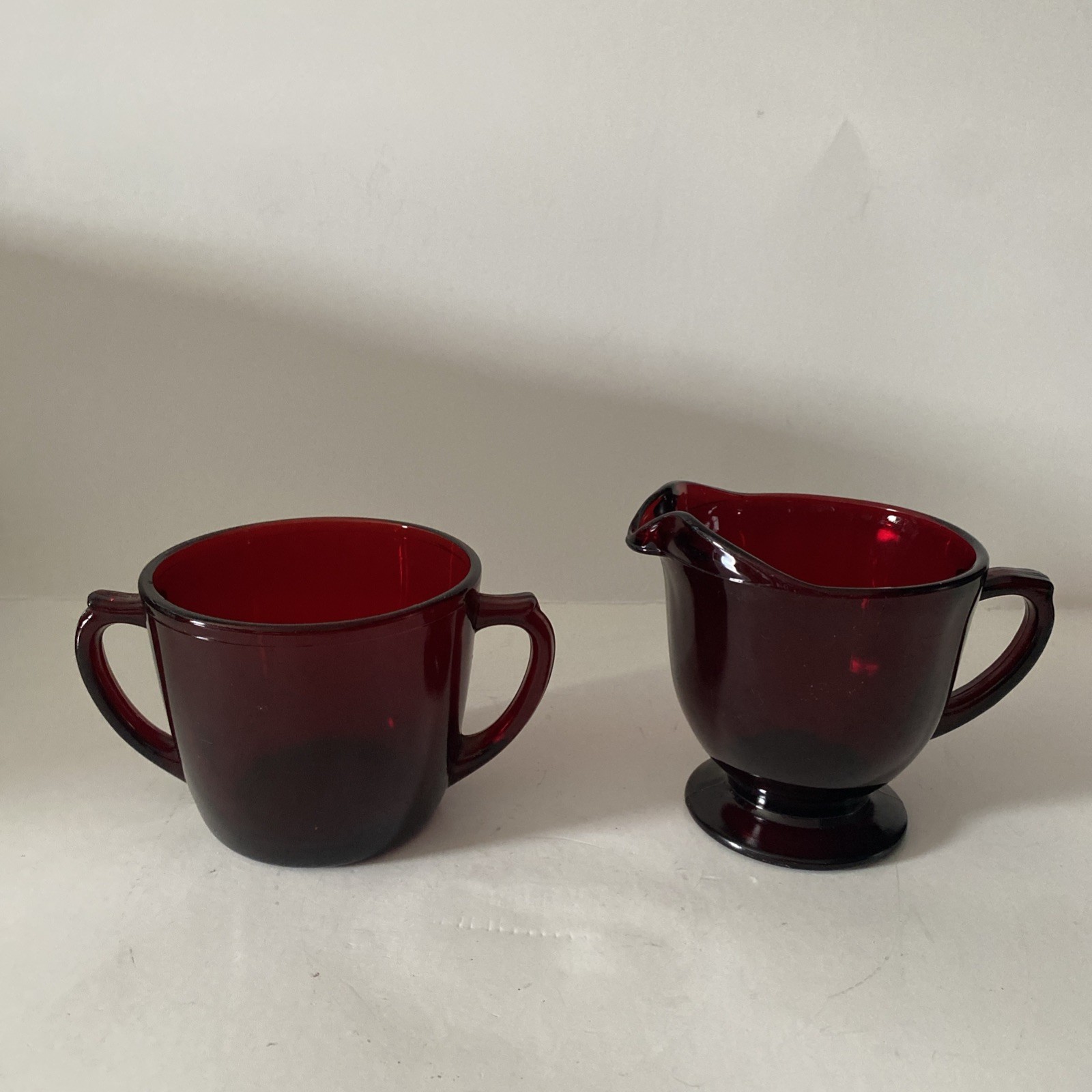 Vintage Anchor Hocking Royal Ruby glass sugar bowl and creamer set.