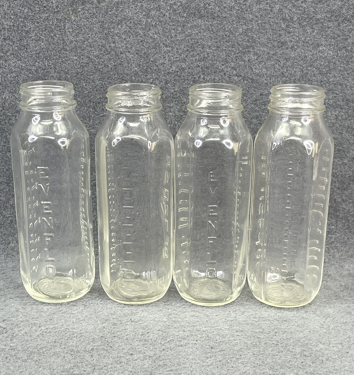 4 Evenflo Vintage Glass Bottles 8oz. Excellent Condition