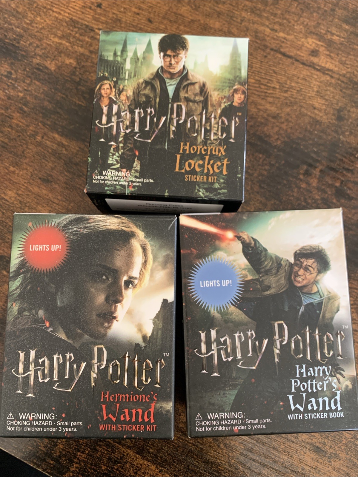 Set Of 3.: Harry Potter Wand, Hermione’s Wand, Horcrux Locket. (NO STICKER BOOK)