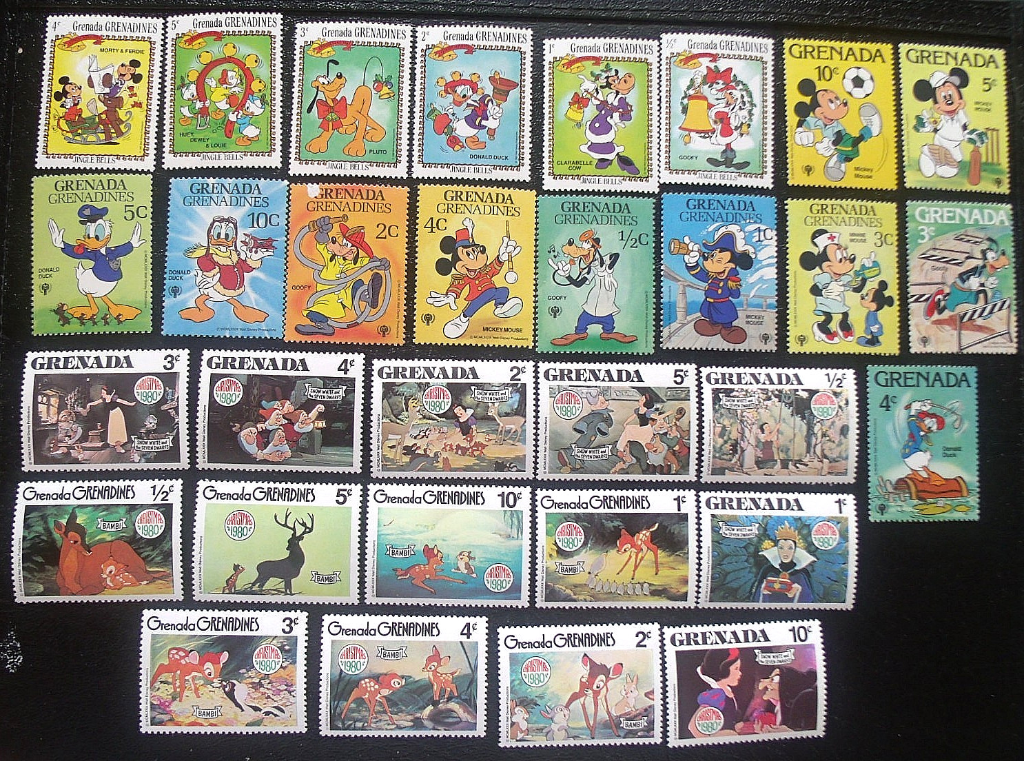 31 Greneda Stamps -  Lot#Ec4  Disney etc.