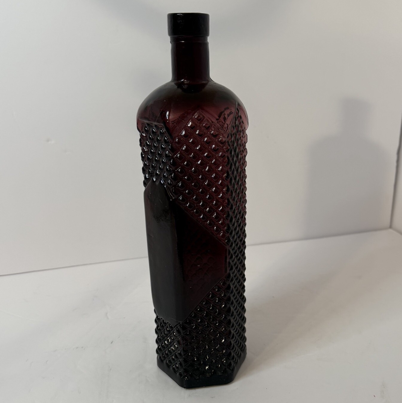 12.25” Tall -Thick Patterned Glass Purple Cranberry 6 Sided Vintage Bottle
