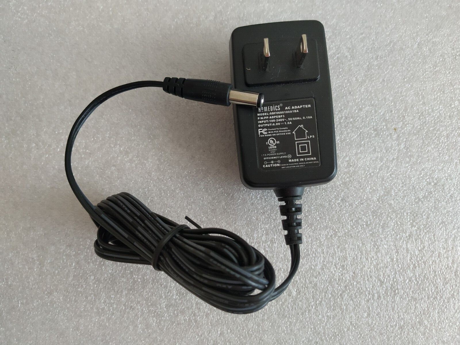  AC/DC Adapter INPUT:100-240V 50-60Hz 0.18A OUTPUT: 6.0V 1.0A  5mm plug tip