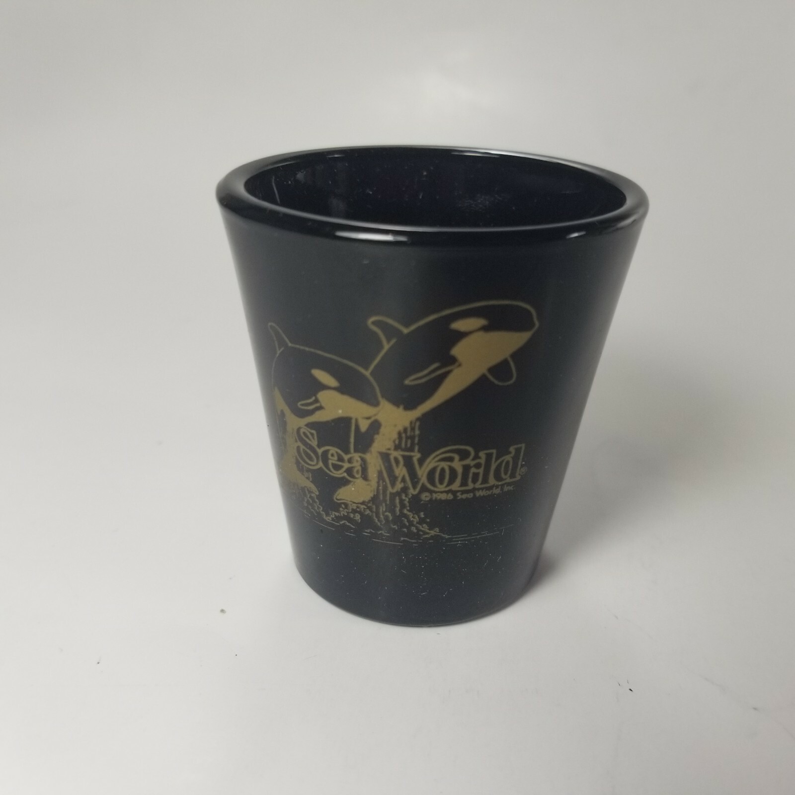 Sea World Vintage Shot Glass Black Gold Dolphin Whales 1996 Vintage