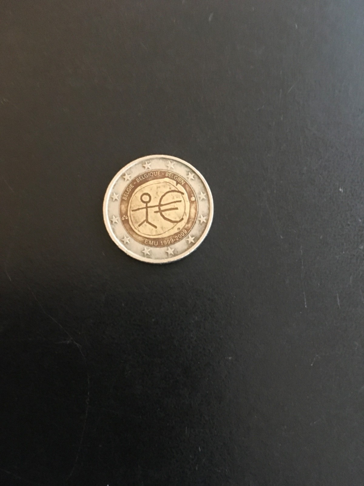 2 Euro coin Belgium com erasing 10 years of EMU 1999-2009  good circulated.