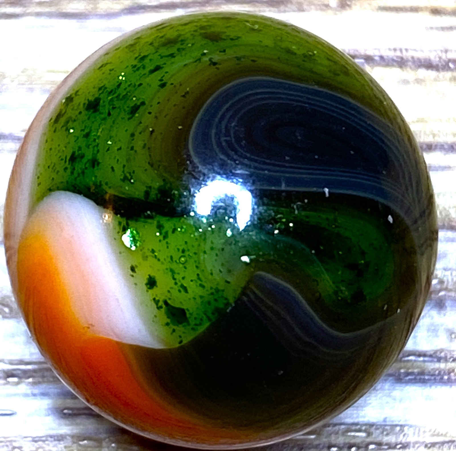 DAS/JABO HEAVY AVENTURINE AND BRIGHT ORANGE SWIRLED SHOOTER .72" BOX03/334