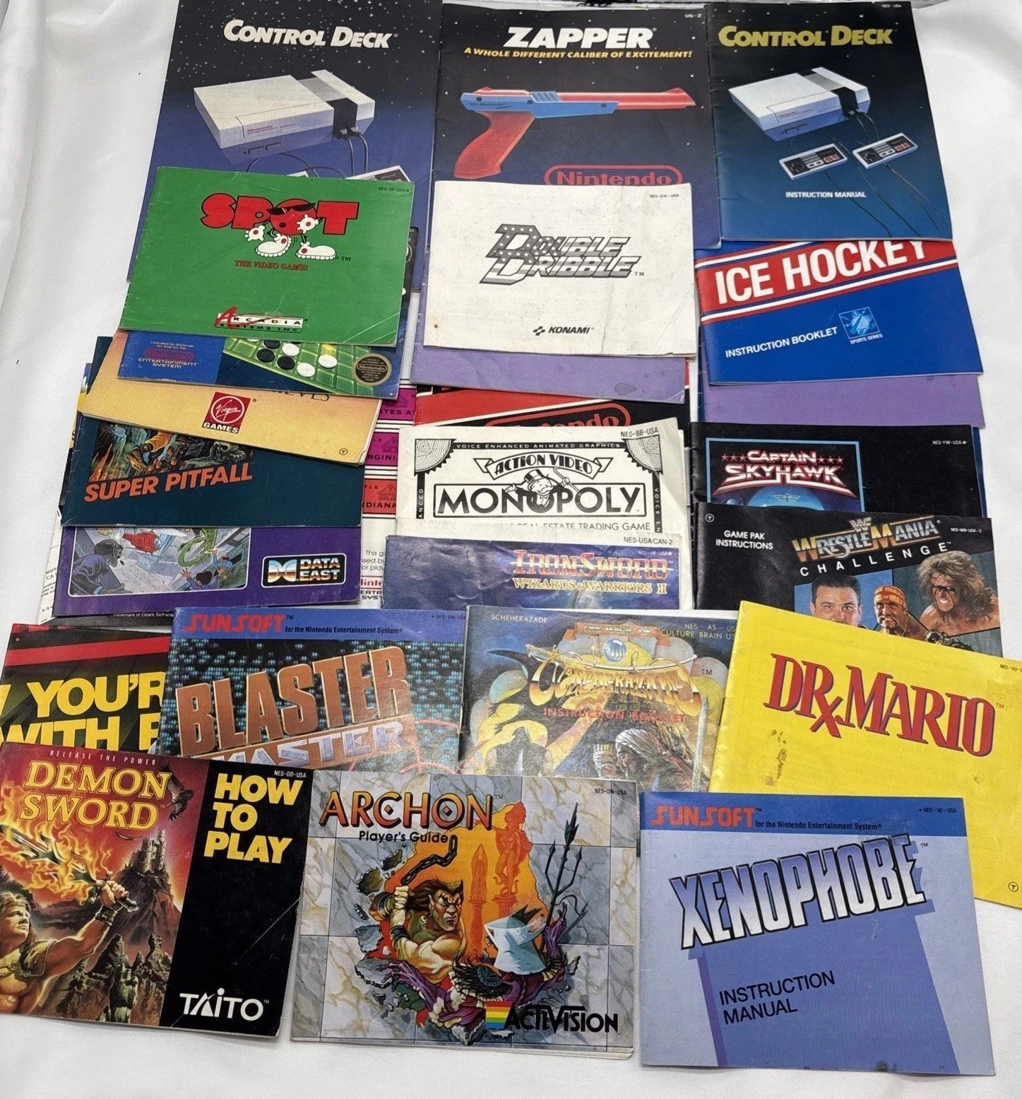 20+ Nintendo NES  Manual Lot Posters Mario, Iron Sword Demon Tetris, Robin Hood.