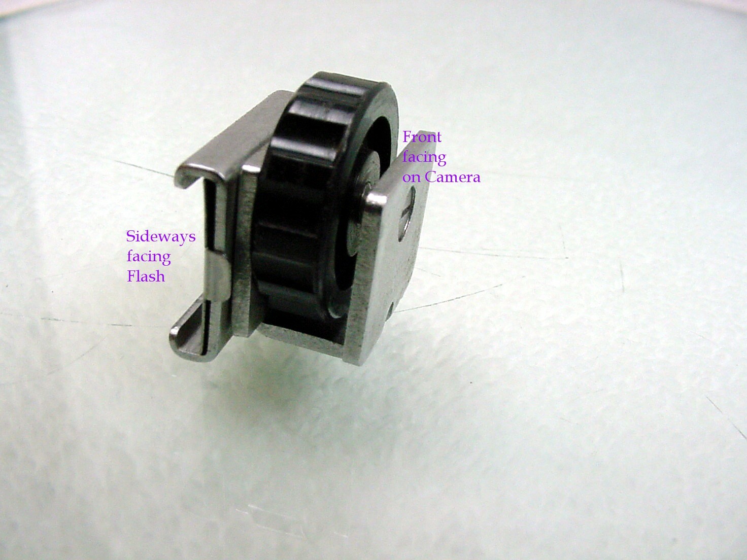 Adapter from Camera shoe to mount flash sideways (flash turned 90 degrees) | $9